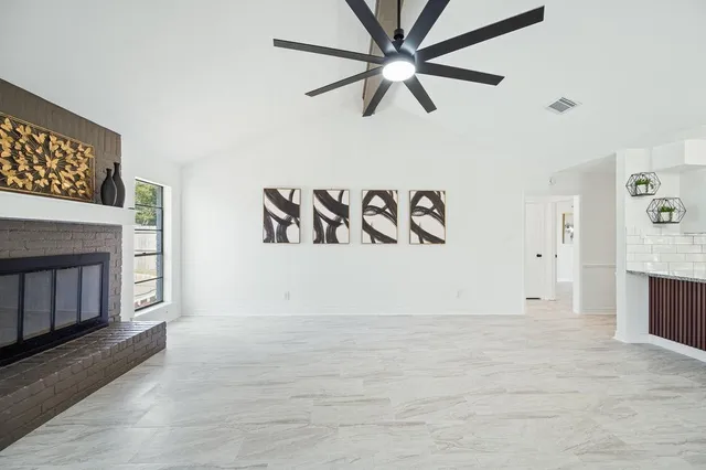 a view of kitchen and hall with wooden floor