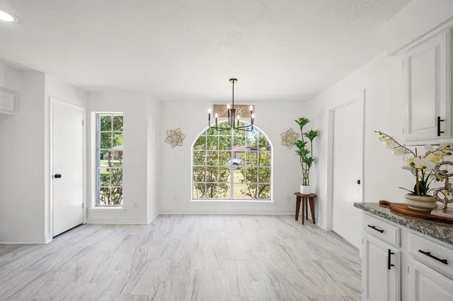 a kitchen with stainless steel appliances a refrigerator sink and stove