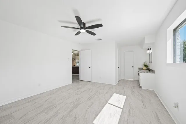 a white bath tub sitting next to a white sink