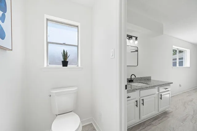 a view of room with window ceiling fan