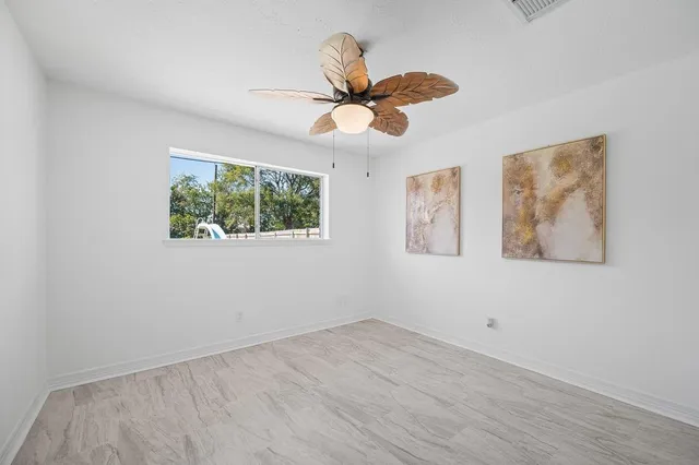 a view of a swimming pool with a yard