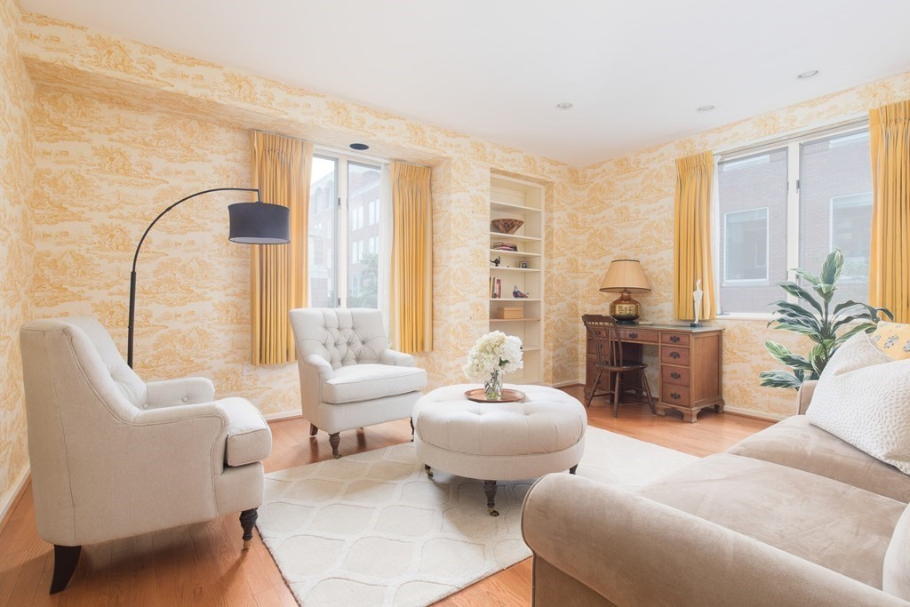 130 Mt Auburn Street, Unit 310 Cambridge, MA 02138 - Photo 11 of 21 a living room with furniture and a large window