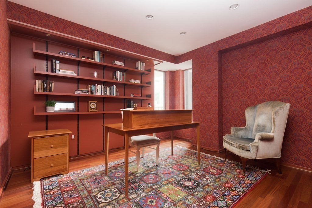 130 Mt Auburn Street, Unit 310 Cambridge, MA 02138 - Photo 12 of 21 a living room with furniture and a rug