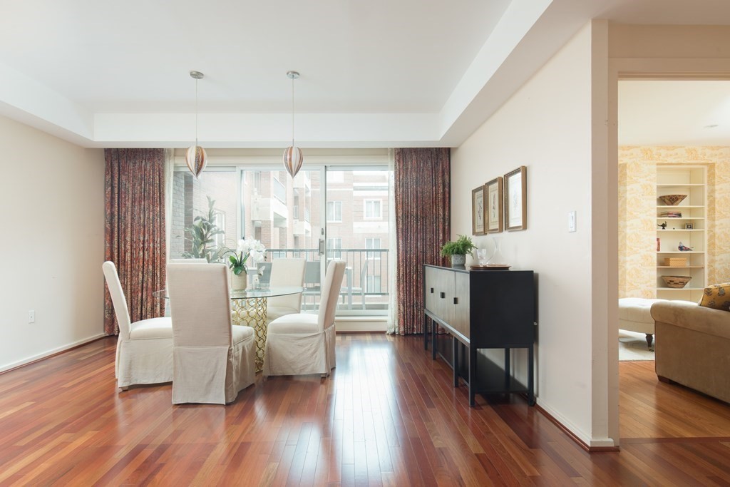 130 Mt Auburn Street, Unit 310 Cambridge, MA 02138 - Photo 15 of 21 a living room with furniture and wooden floor