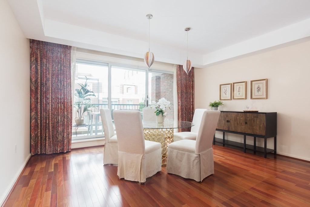 130 Mt Auburn Street, Unit 310 Cambridge, MA 02138 - Photo 18 of 21 a living room with furniture and a wooden floor