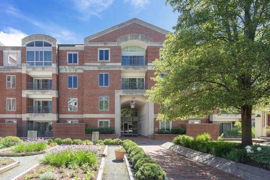 130 Mt Auburn Street, Unit 310 Cambridge, MA 02138 - Photo 21 of 21 a front view of a building with garden
