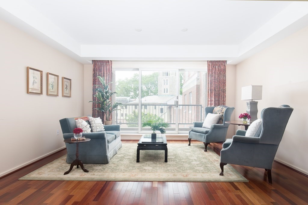 130 Mt Auburn Street, Unit 310 Cambridge, MA 02138 - Photo 3 of 21 a living room with furniture and a large window