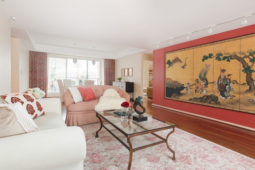 130 Mt Auburn Street, Unit 310 Cambridge, MA 02138 - Photo 5 of 21 a living room with furniture and a large window