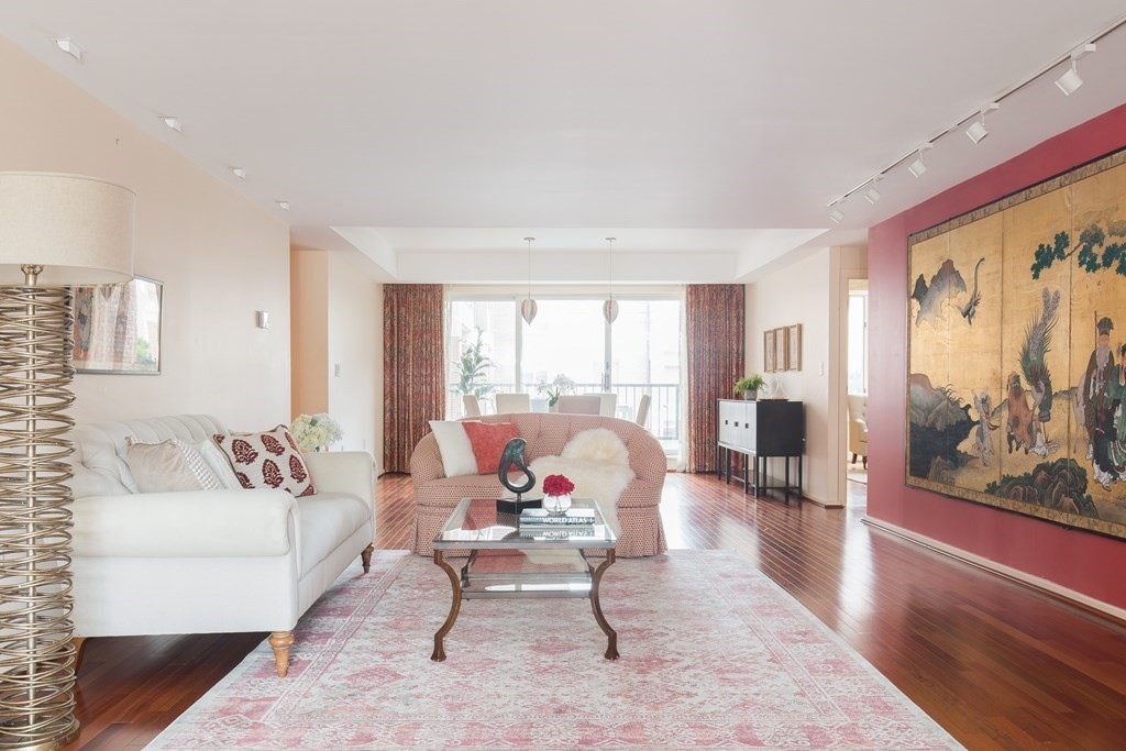 130 Mt Auburn Street, Unit 310 Cambridge, MA 02138 - Photo 6 of 21 a living room with furniture and a large window