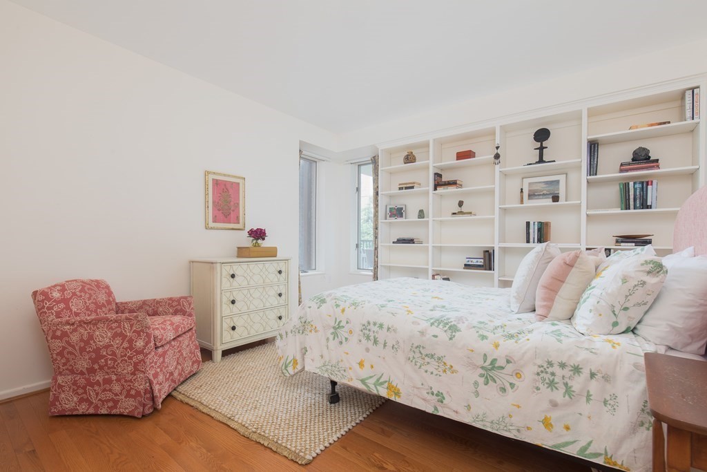 130 Mt Auburn Street, Unit 310 Cambridge, MA 02138 - Photo 7 of 21 a bedroom with a bed and a couch