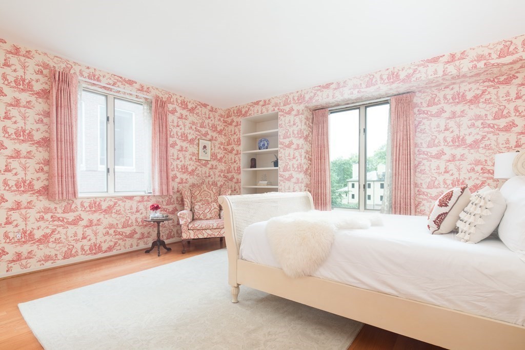 130 Mt Auburn Street, Unit 310 Cambridge, MA 02138 - Photo 9 of 21 a bedroom with a large bed and a couch