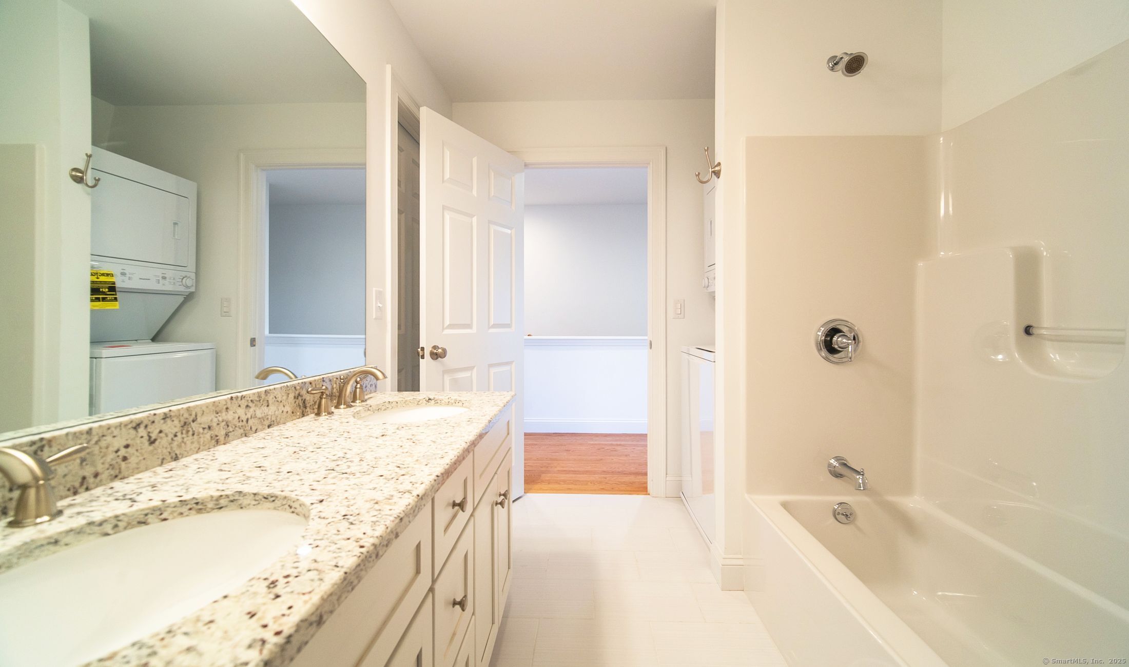 10 Fort Hill Road, Unit 6C Groton, CT 06340 - Photo 13 of 24 a spacious bathroom with a granite countertop tub sink and mirror