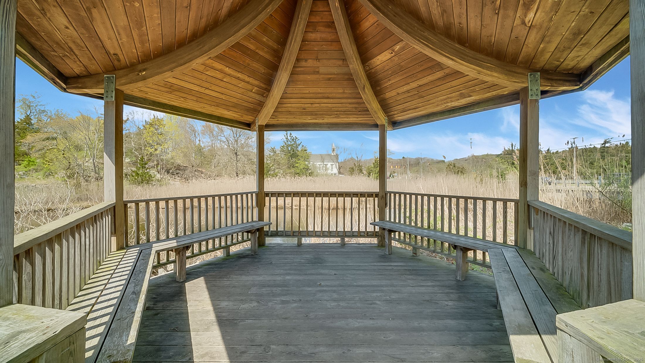 10 Fort Hill Road, Unit 6C Groton, CT 06340 - Photo 23 of 24 a view of outdoor space with wooden floor and outdoor seating