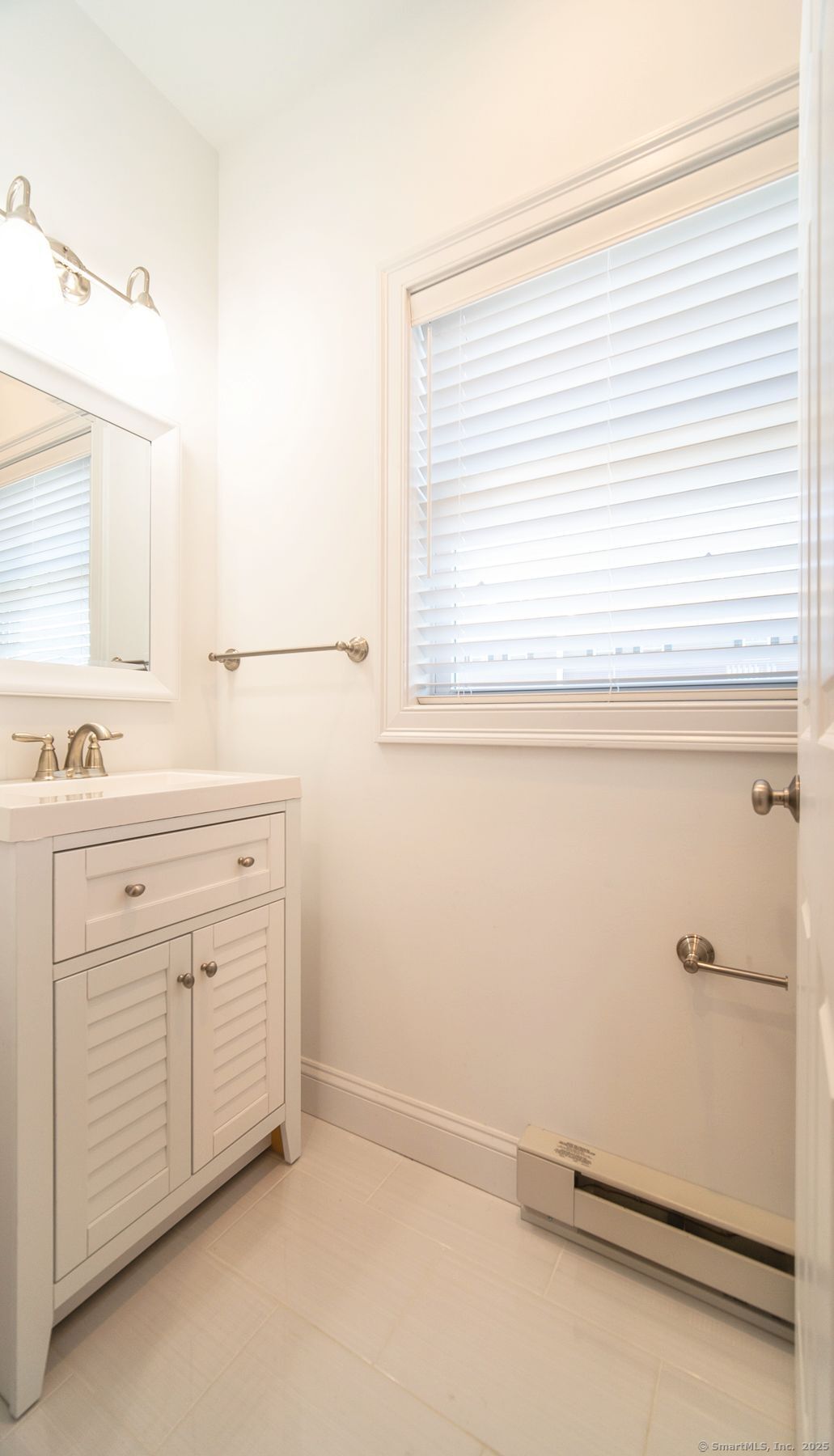 10 Fort Hill Road, Unit 6C Groton, CT 06340 - Photo 9 of 24 a view of a kitchen with white cabinets