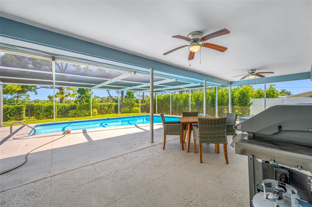 656 Mehlenbacher Road Belleair, FL 33756 - Photo 20 of 49 a view of a patio with a table and chairs