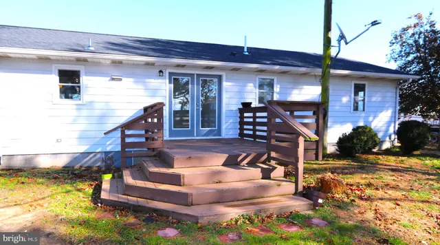 a view of an house with swimming pool and sitting area
