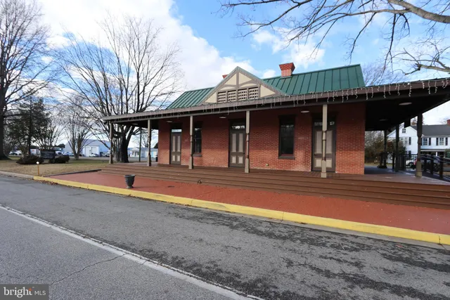 a large parking space with wooden fence