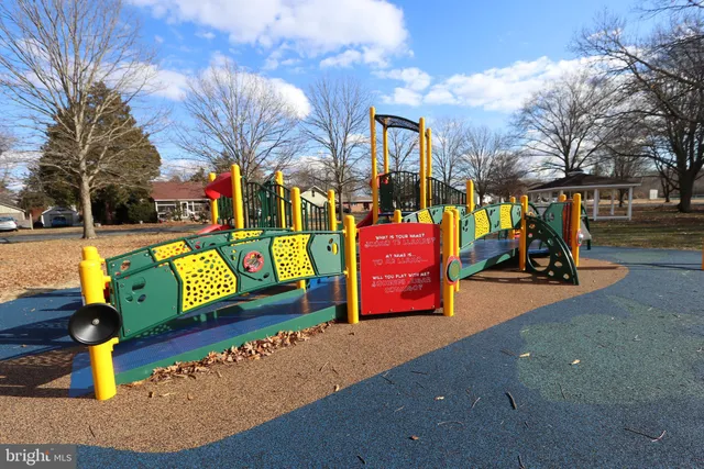a view of a street with a building in the background