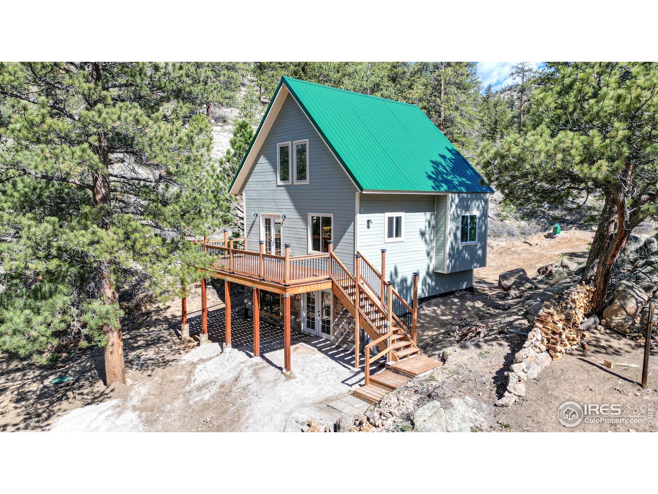 80 Hot Spur Lane Drake, CO 80515 - Photo 1 of 40 a house with trees in the background