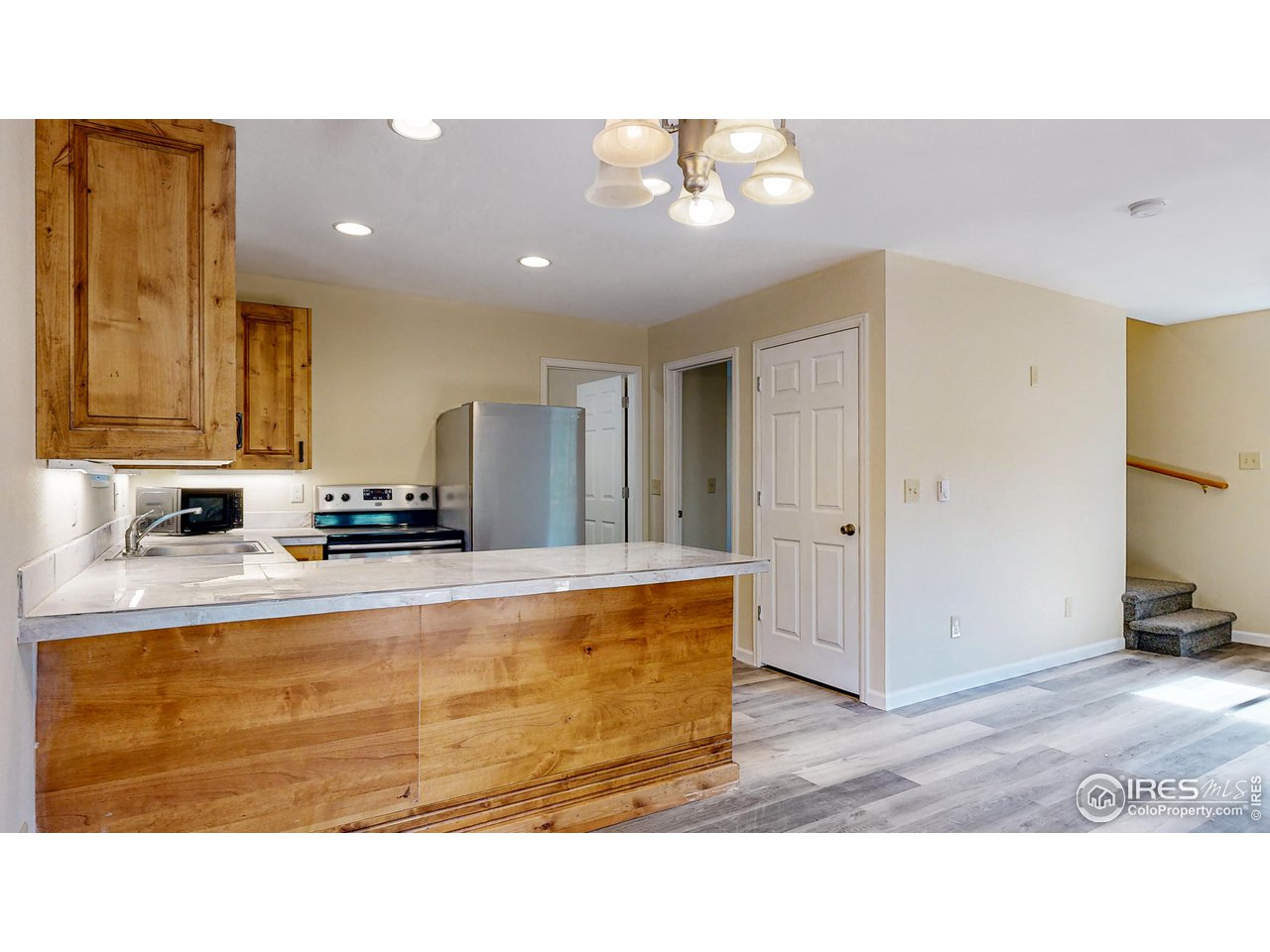 80 Hot Spur Lane Drake, CO 80515 - Photo 14 of 40 a kitchen with kitchen island sink and refrigerator
