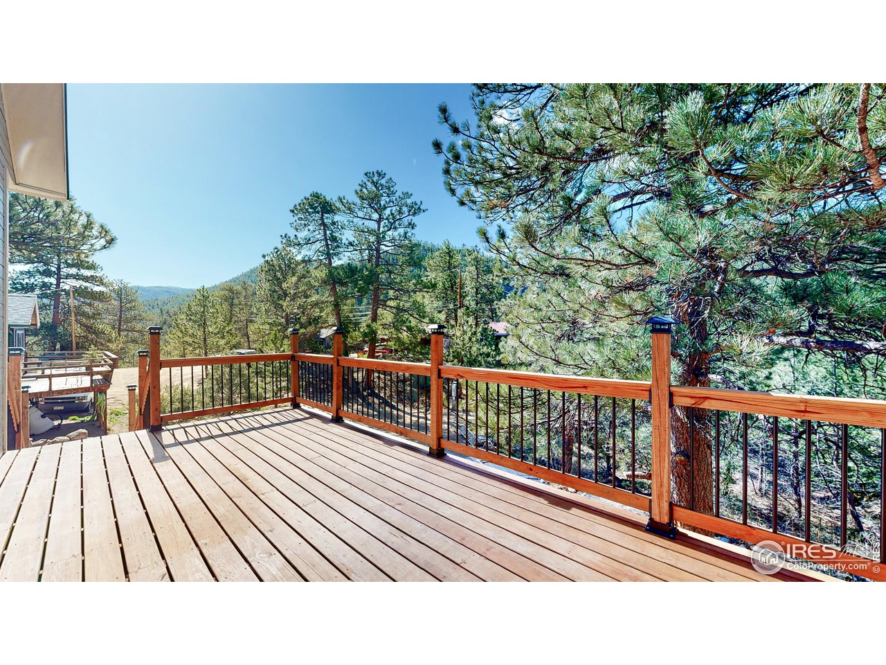 80 Hot Spur Lane Drake, CO 80515 - Photo 2 of 40 a view of balcony with wooden floor and fence