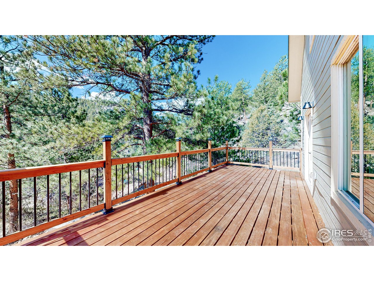 80 Hot Spur Lane Drake, CO 80515 - Photo 3 of 40 a view of balcony with wooden floor and bench