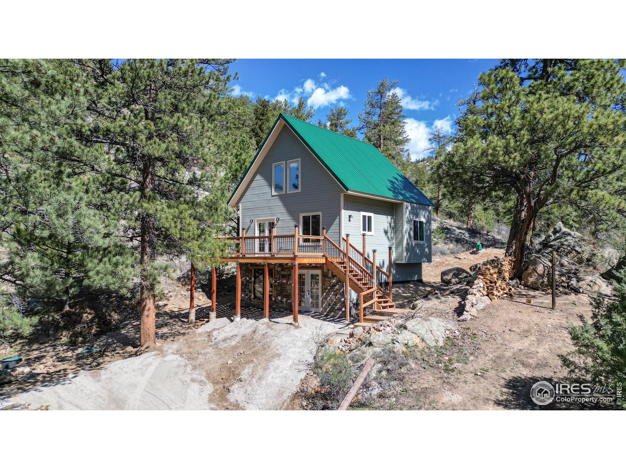 80 Hot Spur Lane Drake, CO 80515 - Photo 36 of 40 a balcony with furniture and a garden