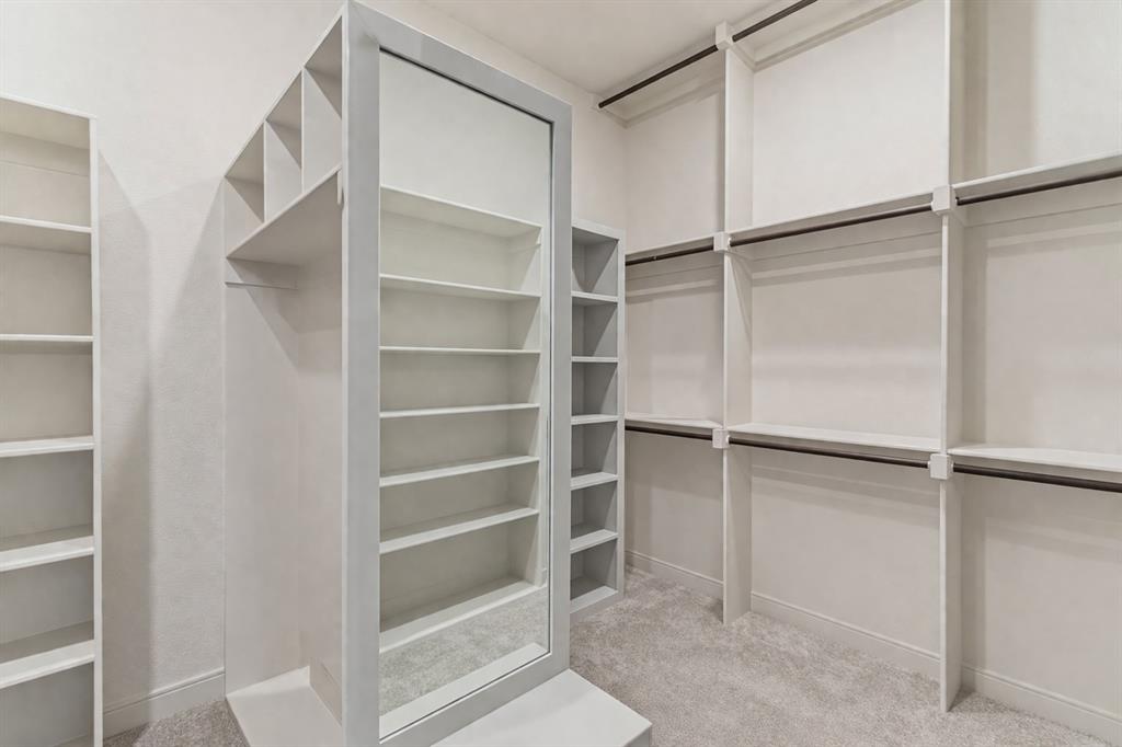 150 Las Brisas Drive Decatur, TX 76234 - Photo 17 of 33 *Virtually Staged* Custom closet system featuring extensive shelving and hanging rods