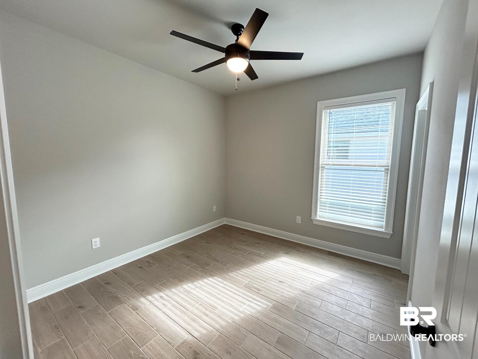 808 Sumter Loop Foley, AL 36535 - Photo 12 of 18 Unfurnished room with light hardwood / wood-style flooring and ceiling fan