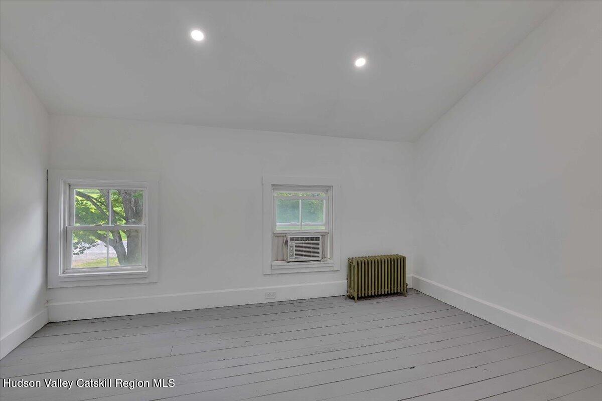 1670 County Rte 30 Salem, NY 12865 - Photo 16 of 59 a view of empty room with window and wooden floor
