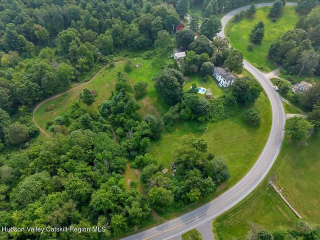 a bathroom with a tub and a window