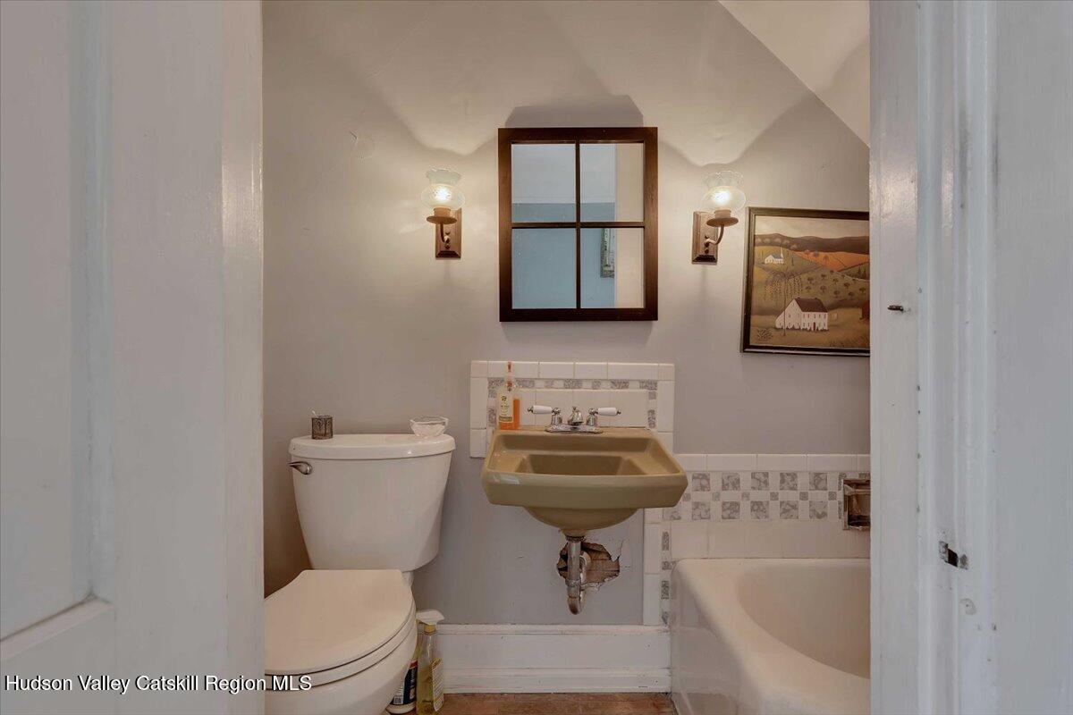 1670 County Rte 30 Salem, NY 12865 - Photo 27 of 59 a bathroom with a toilet a sink and bathtub