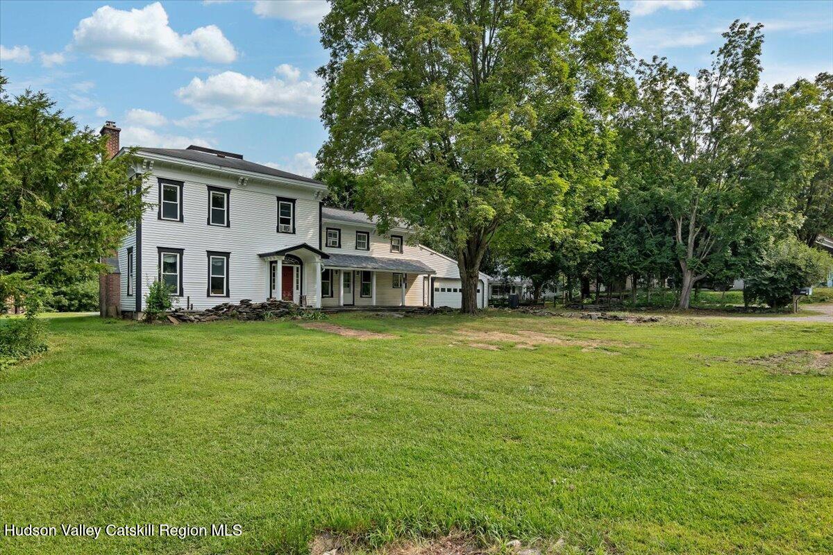1670 County Rte 30 Salem, NY 12865 - Photo 53 of 59 a front view of a house with a garden