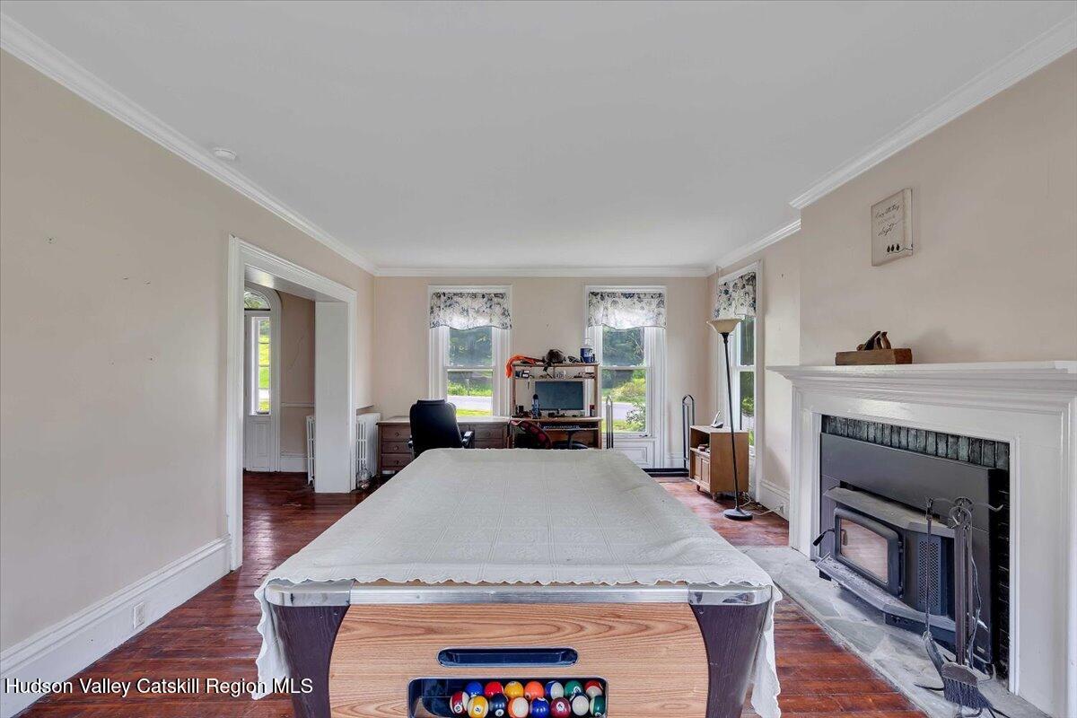 1670 County Rte 30 Salem, NY 12865 - Photo 8 of 59 a bedroom with a bed and a fireplace