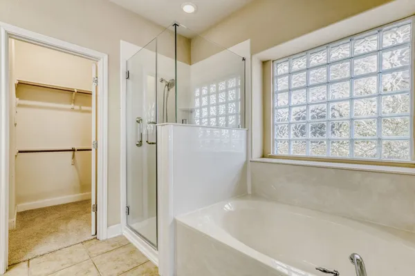 an empty room with mirror and entrance