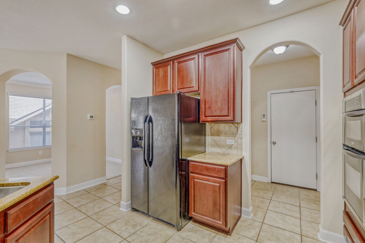 24 Stone Terrace Drive Austin, TX 78734 - Photo 9 of 31 Kitchen with stainless steel refrigerator, negotiable.