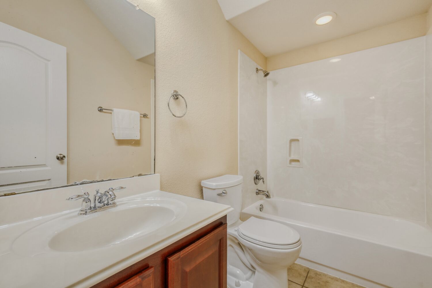 24 Stone Terrace Drive Austin, TX 78734 - Photo 23 of 31 Upstairs Full bathroom with vanity, shower / bathtub combination, light tile patterned floors, and recessed lighting