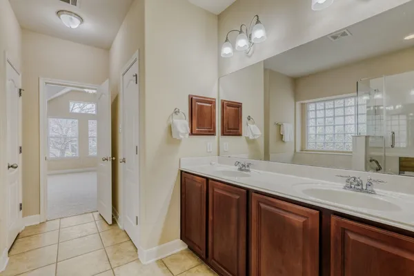 a kitchen with kitchen island granite countertop white cabinets and stainless steel appliances