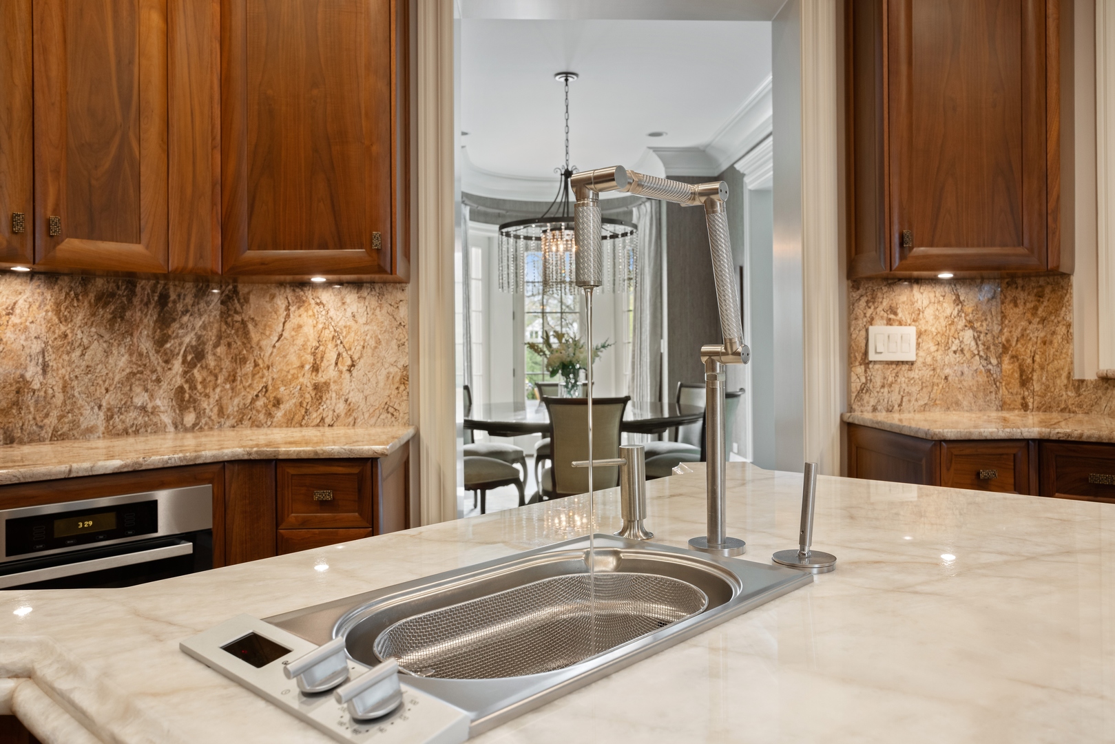 106 Longmeadow Road Winnetka, IL 60093 - Photo 15 of 66 a kitchen with granite countertop a sink and a stove top oven