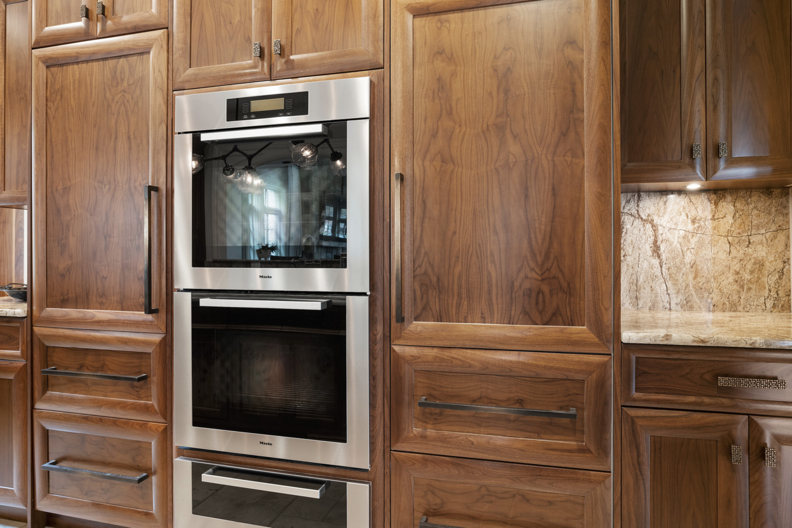106 Longmeadow Road Winnetka, IL 60093 - Photo 17 of 66 a kitchen with granite countertop white cabinets and stainless steel appliances