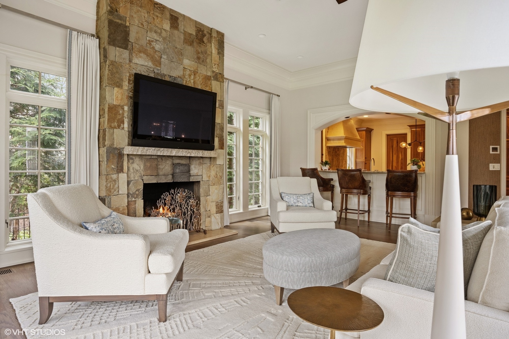 106 Longmeadow Road Winnetka, IL 60093 - Photo 20 of 66 a living room with furniture a flat screen tv and a fireplace