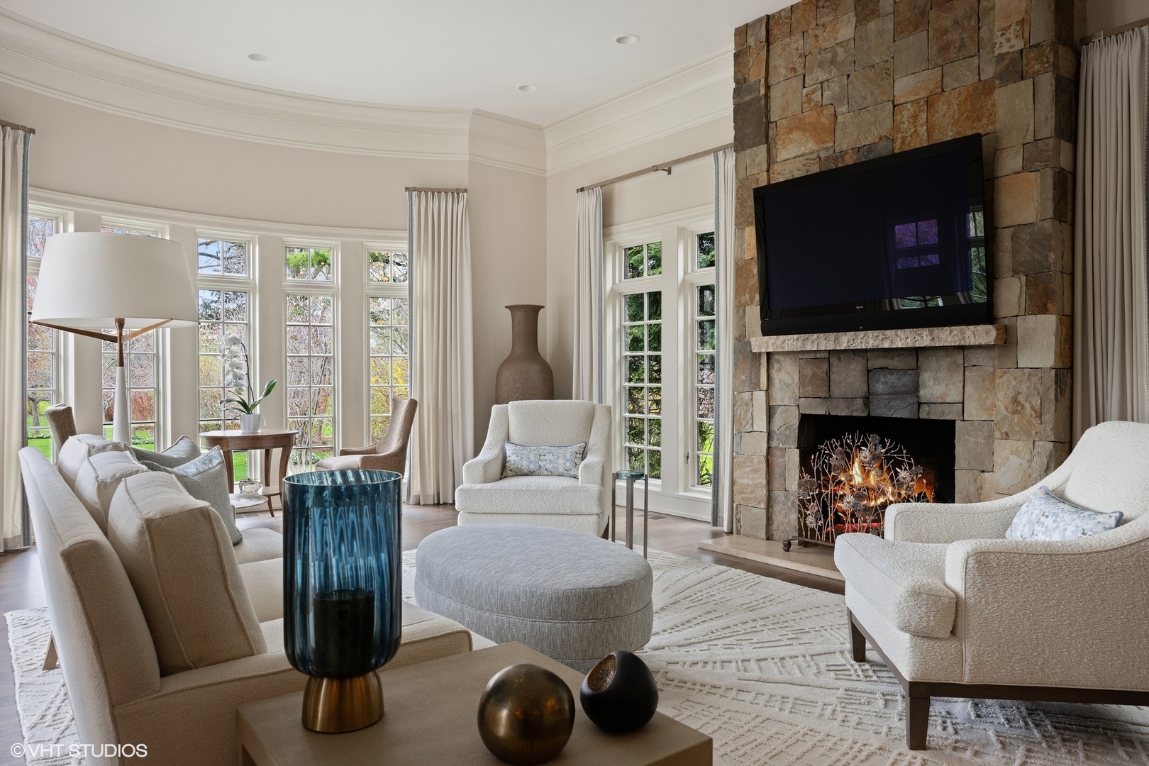 106 Longmeadow Road Winnetka, IL 60093 - Photo 21 of 66 a living room with furniture a flat screen tv and a fireplace