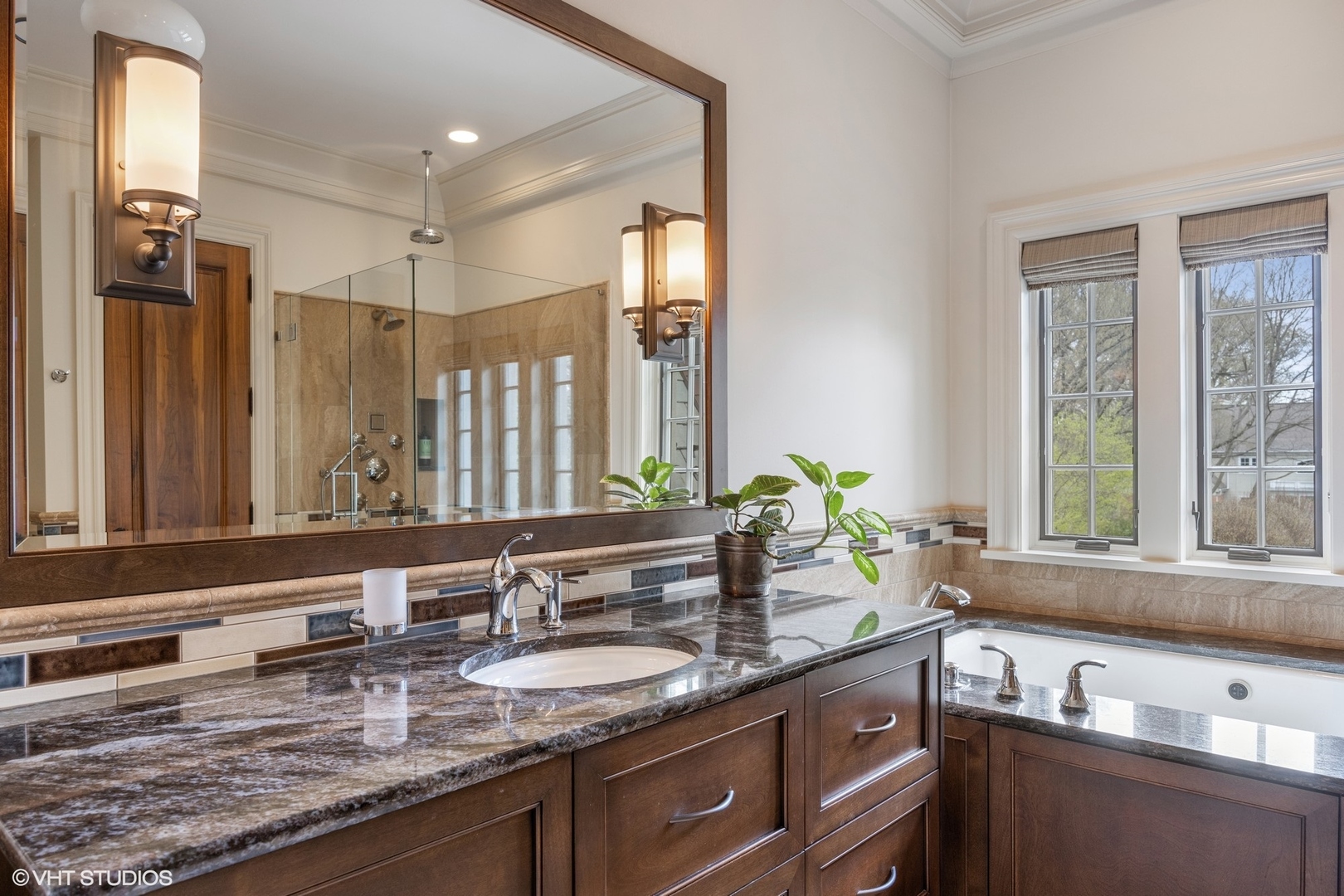 106 Longmeadow Road Winnetka, IL 60093 - Photo 42 of 66 a bathroom with a granite countertop sink and a large mirror