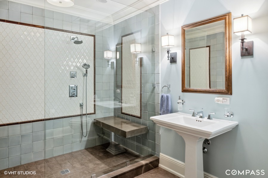 106 Longmeadow Road Winnetka, IL 60093 - Photo 63 of 66 a bathroom with a sink mirror and a shower