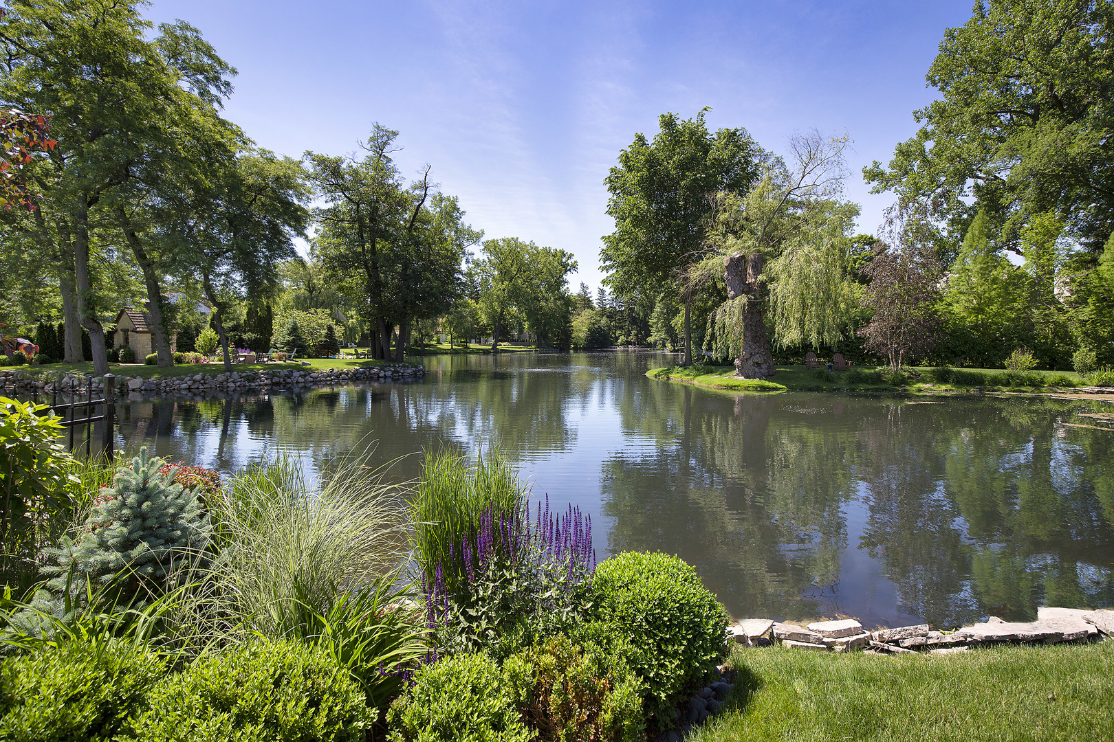 106 Longmeadow Road Winnetka, IL 60093 - Photo 66 of 66 a view of a lake with a building in the background