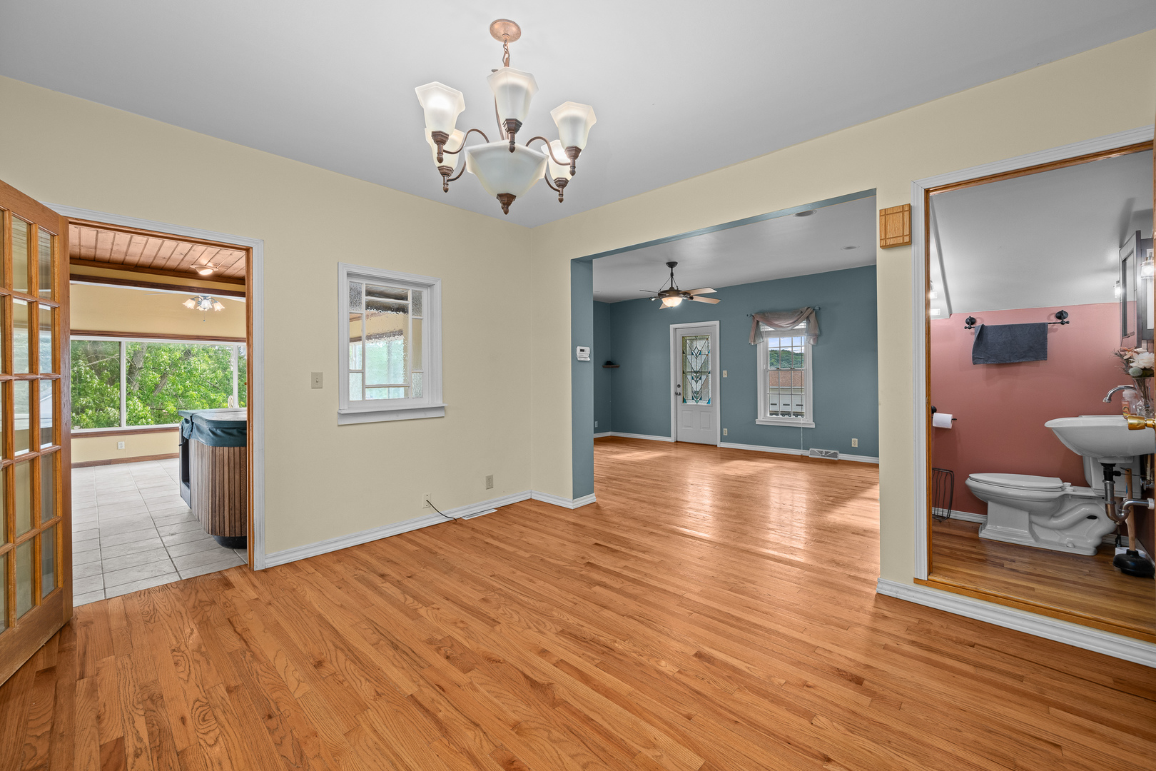 802 North High Street Port Byron, IL 61275 - Photo 16 of 43 a view of a livingroom with wooden floor and chandelier