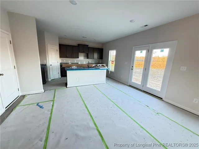 a kitchen with a sink and a stove top oven