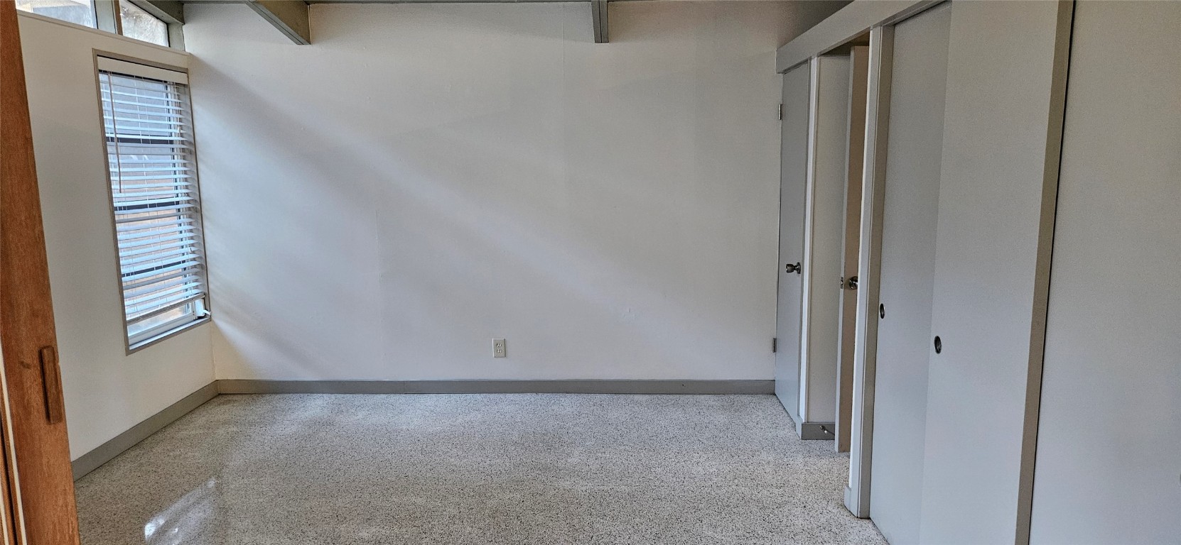506 West 7th Street, Unit B Austin, TX 78701 - Photo 11 of 14 Unfurnished room with baseboards