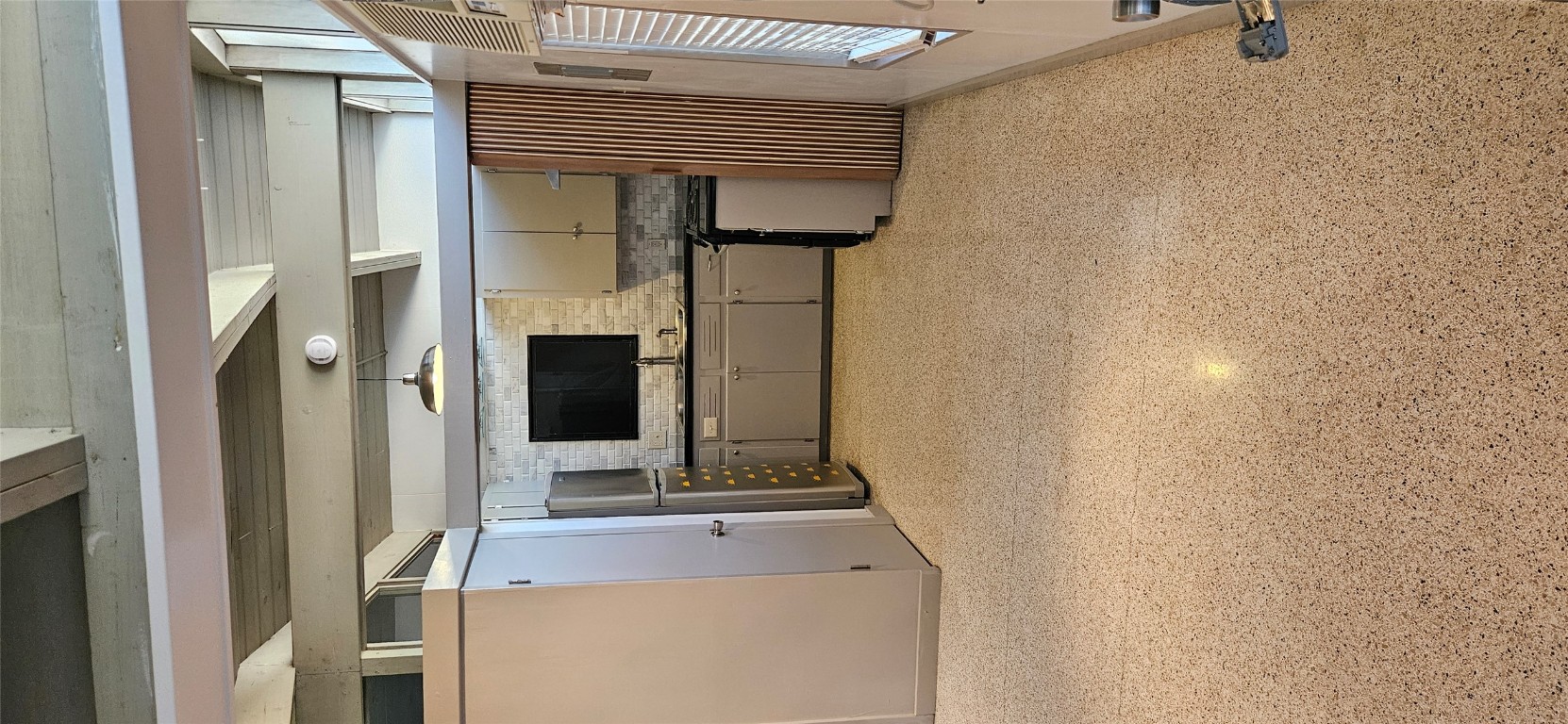 506 West 7th Street, Unit B Austin, TX 78701 - Photo 5 of 14 Kitchen featuring beam ceiling, freestanding refrigerator, and dark countertops