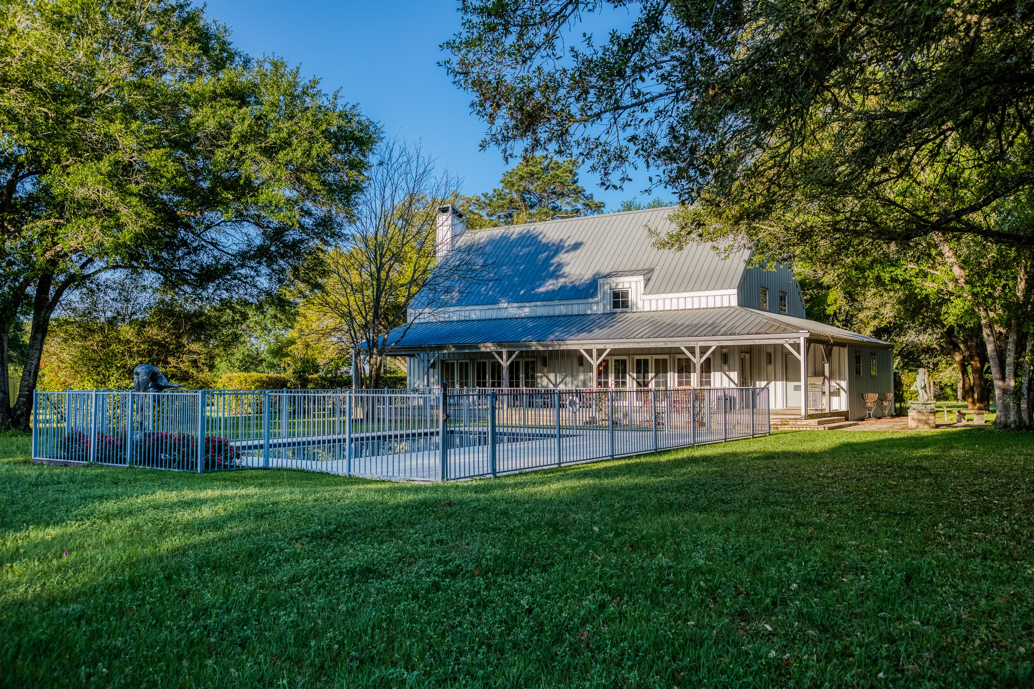 1585 Round Top Road Round Top, TX 78954 - Photo 3 of 26 a front view of a house with a garden